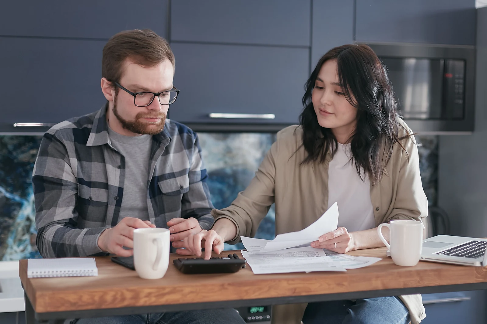 A couple reviewing household finances and calculating a homebuying budget