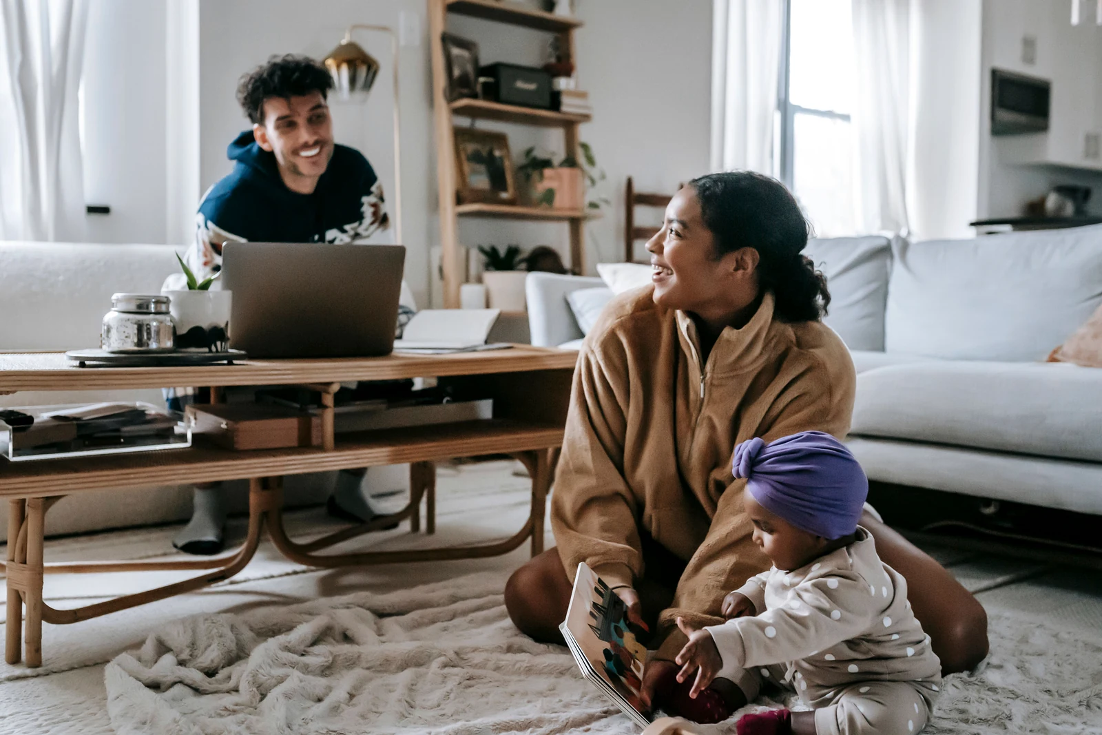 A family using a laptop while planning their next home