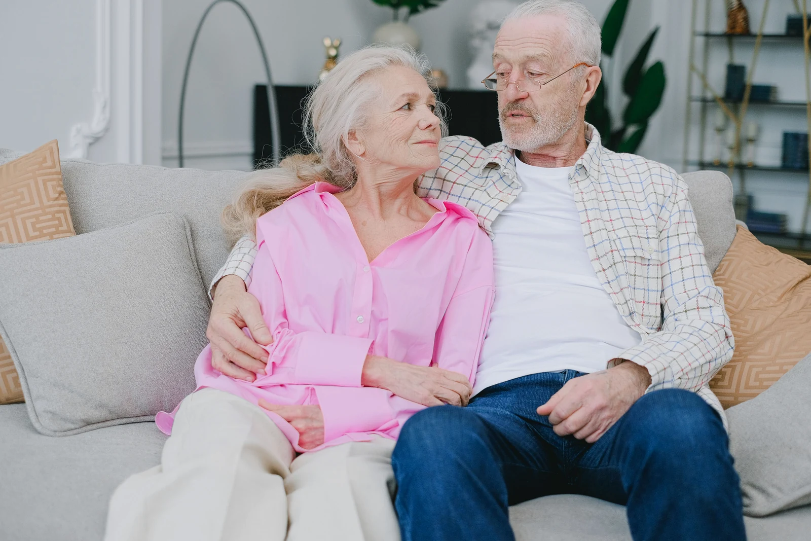Happy homeowners relaxing together at home