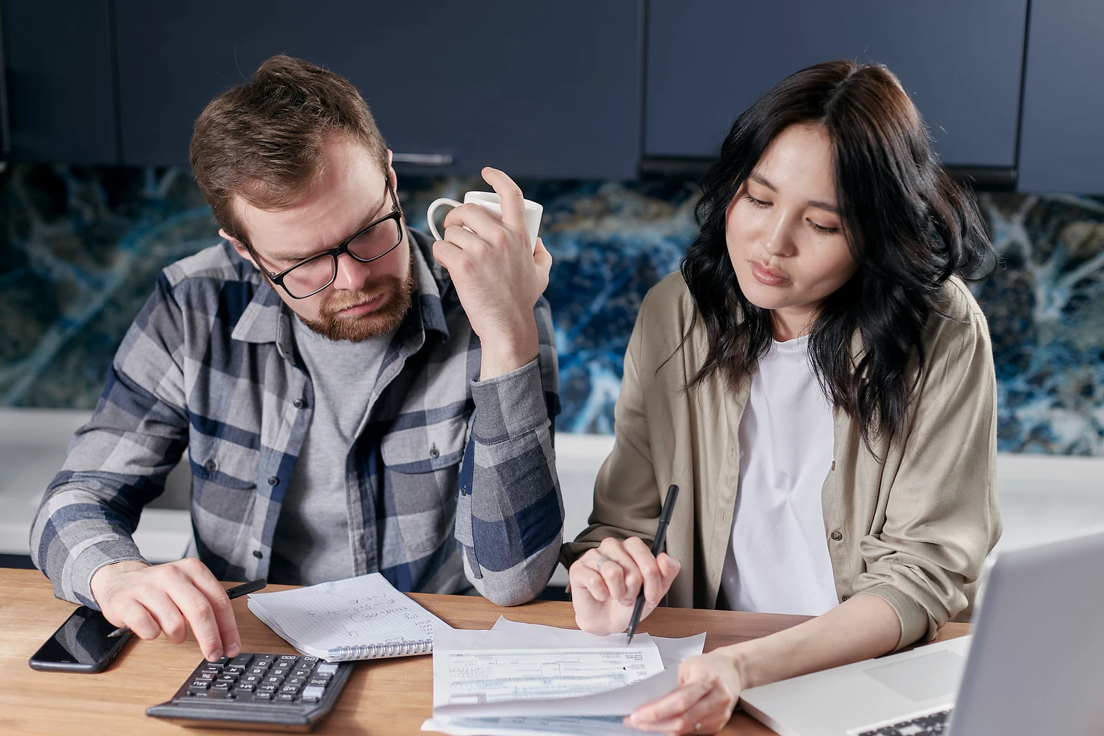 A couple reviewing mortgage documents together