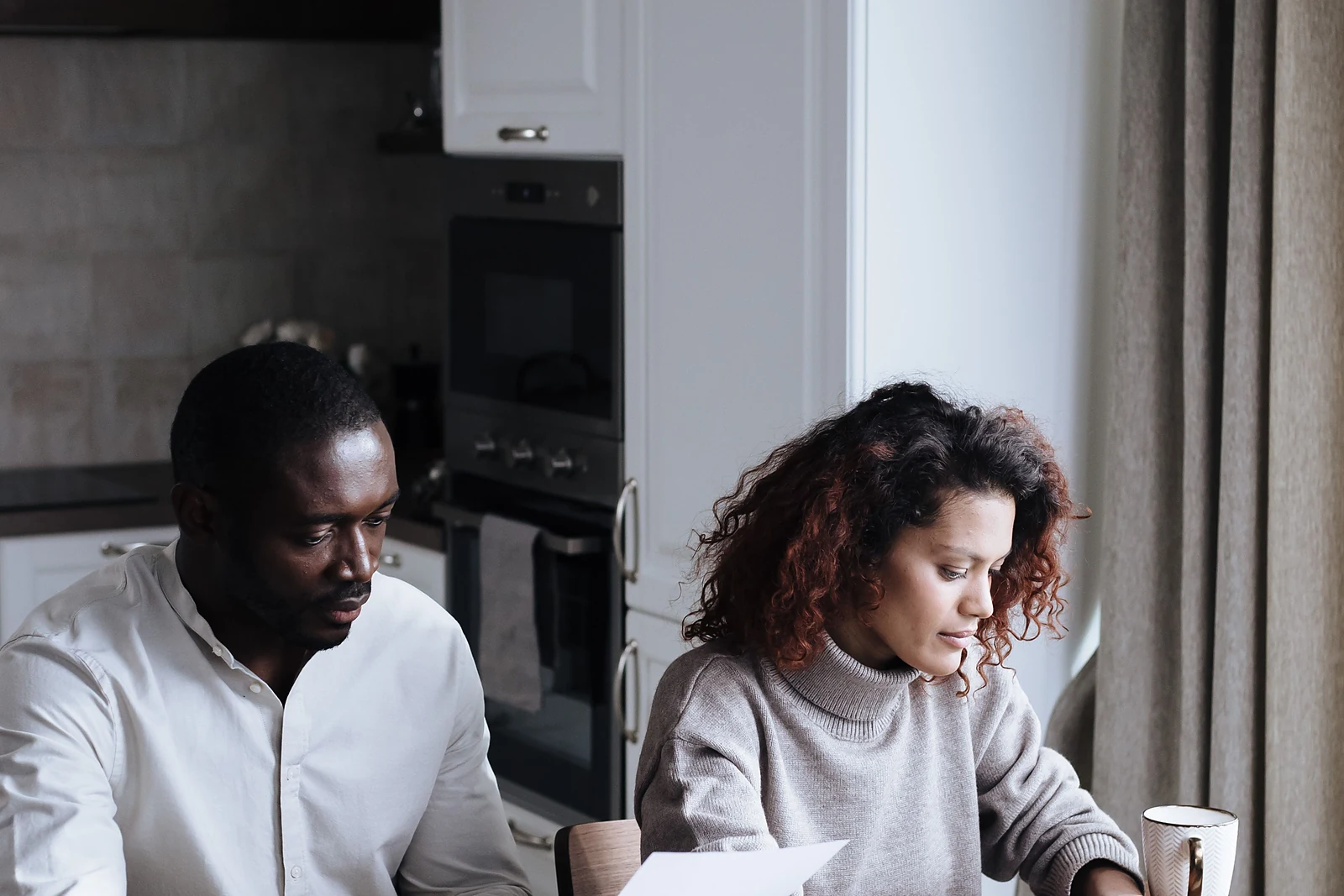 A couple reviewing a homebuying budget and down payment plan together