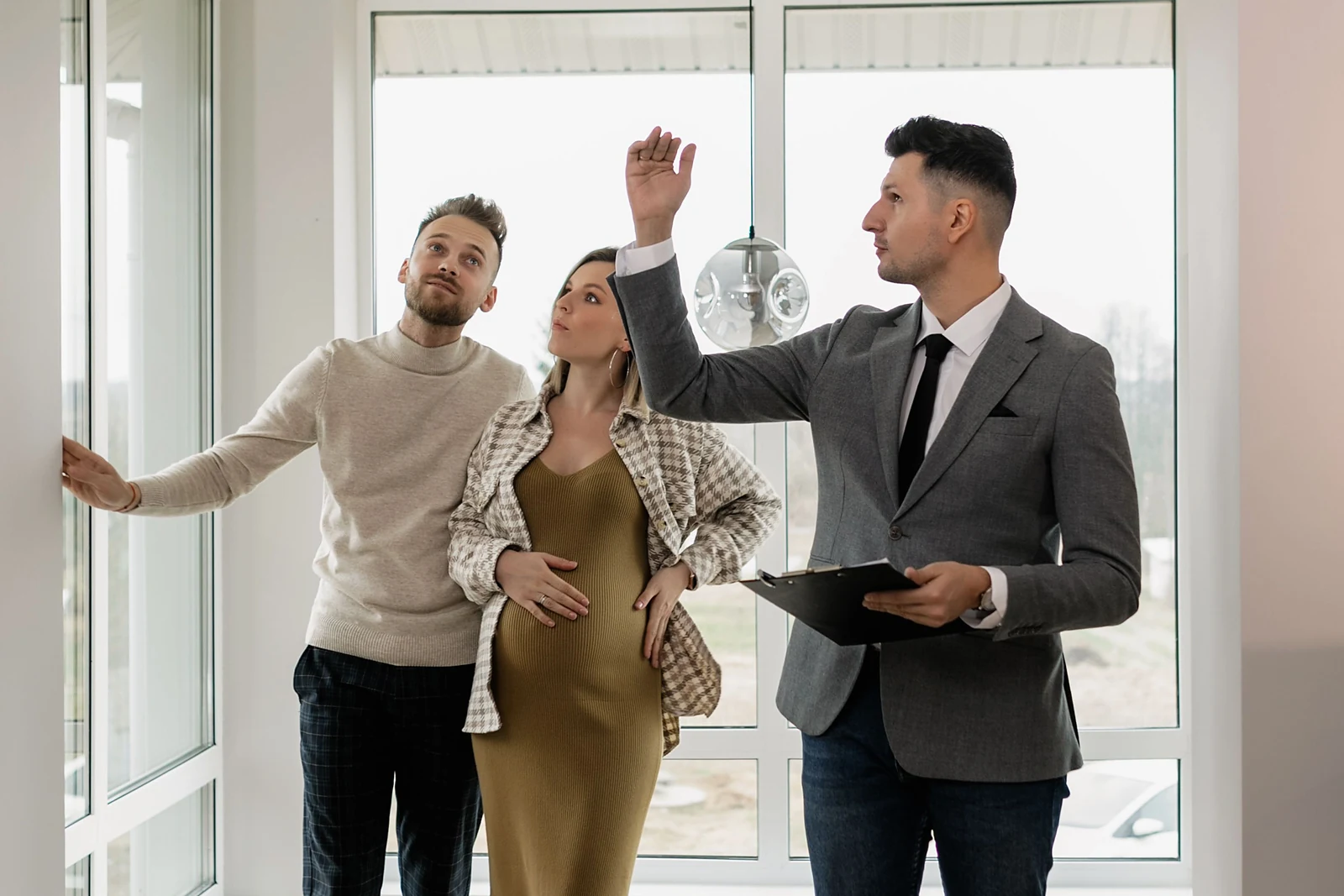 Homebuyers comparing FHA and conventional mortgage information together