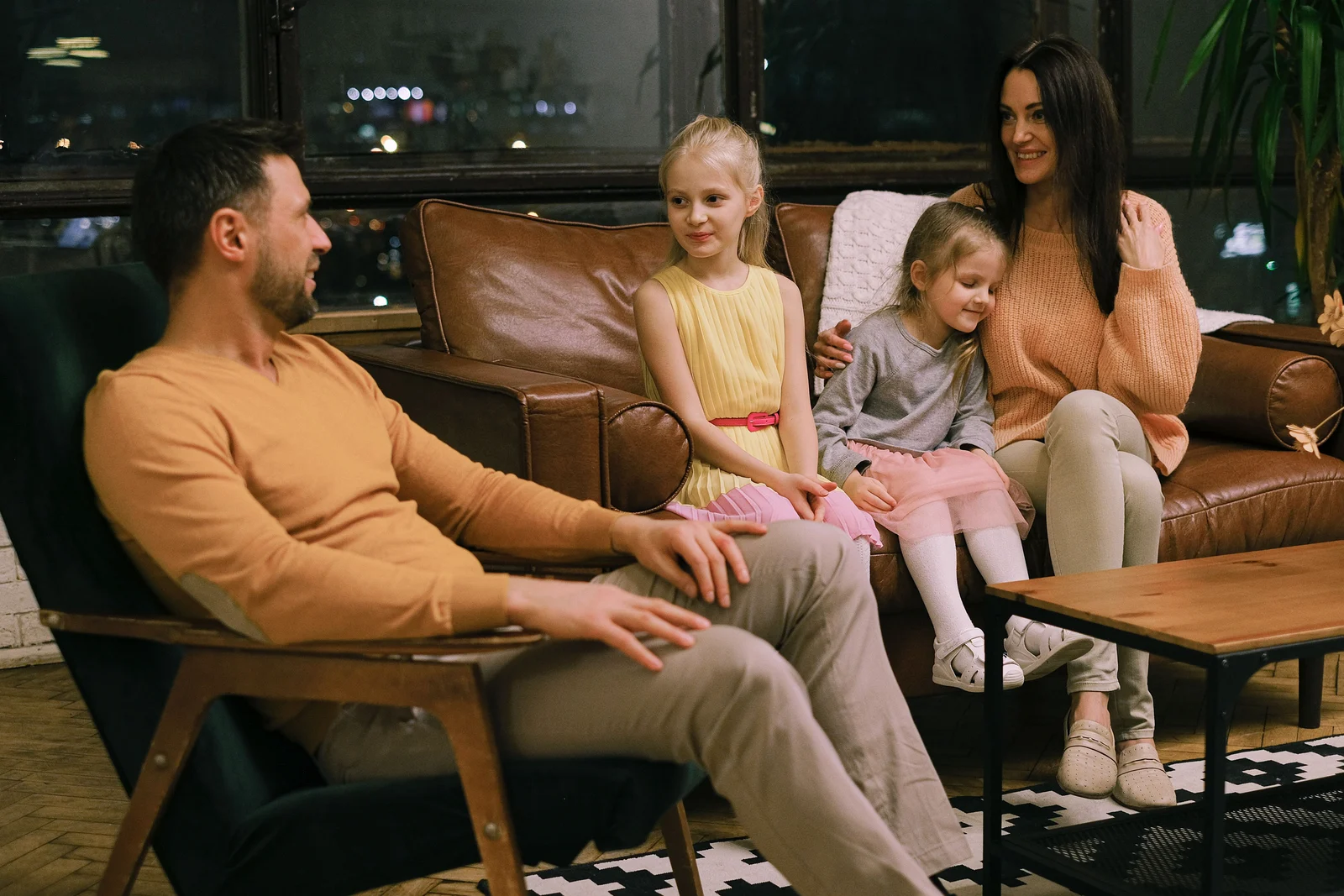 A family gathered together in their living room